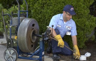 Roto-Rooter Drain Cleaning Expert wearing glasses and protective gear