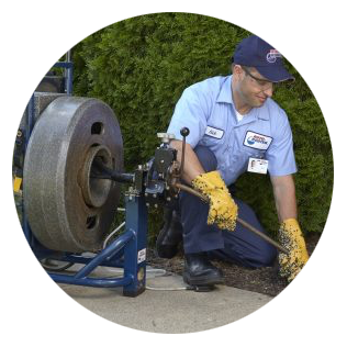 Roto-Rooter drain cleaning specialist cleaning the drains