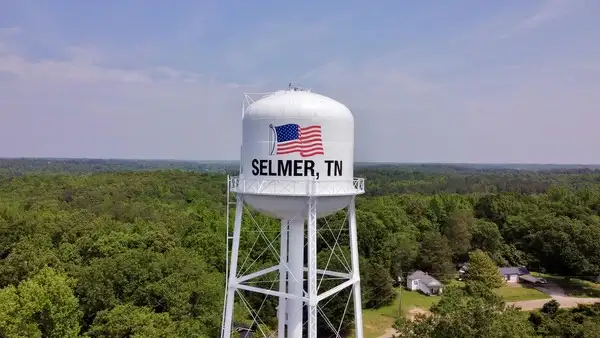 Emergency_Plumber_Water_Damage_Cleanup_Excavation_Roto-Rooter_TN_Selmer City of Selmer, TN Water Tower with a beautiful lanscape behind it