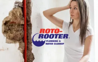 Woman scratcin her head watching red exposed pipe. Roto-Rooter Plumbing