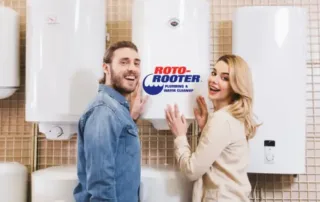 Woman and man Standing in front of a new water heater