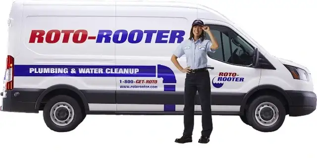 Roto-Rooter female plumber standing in front of van